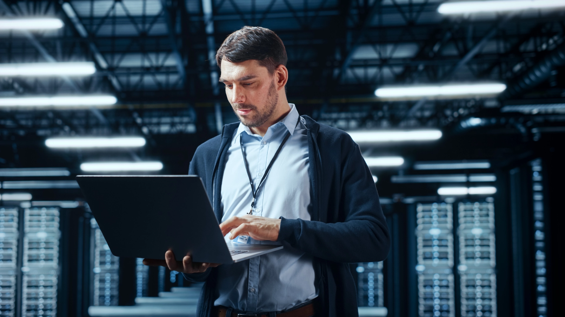 Man holding a laptop in his hand